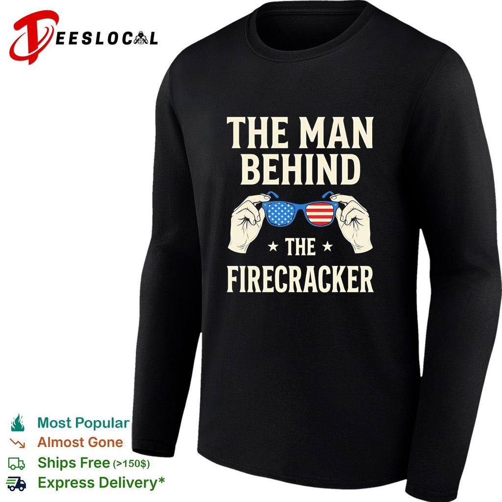 Holding sunglasses with USA flag pattern the man behind the firecracker retro shirt
