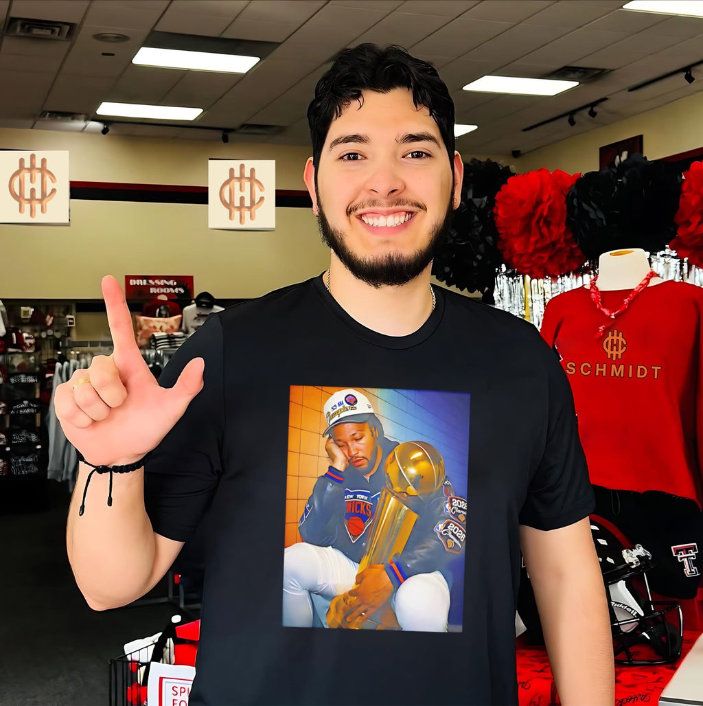 Jalen Brunson holding trophy 2026 NBA Finals Champ MVP shirt