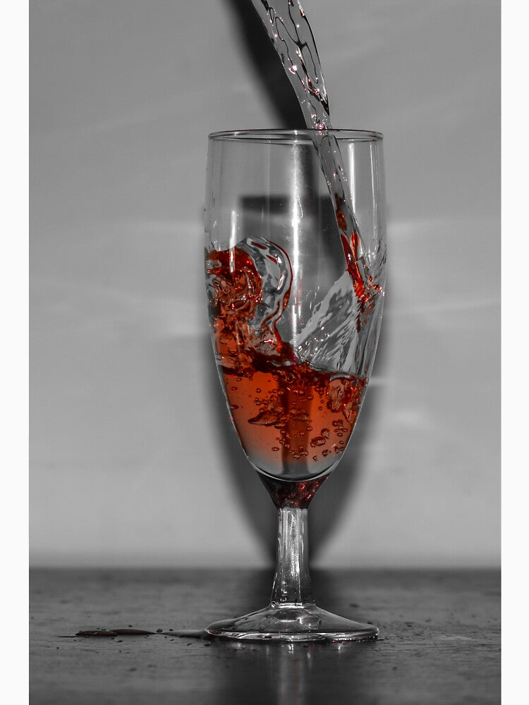 Red Liquid Splash Pouring Into Tall Wine Glass On Table Close-Up High-Speed Shot by Nmallia