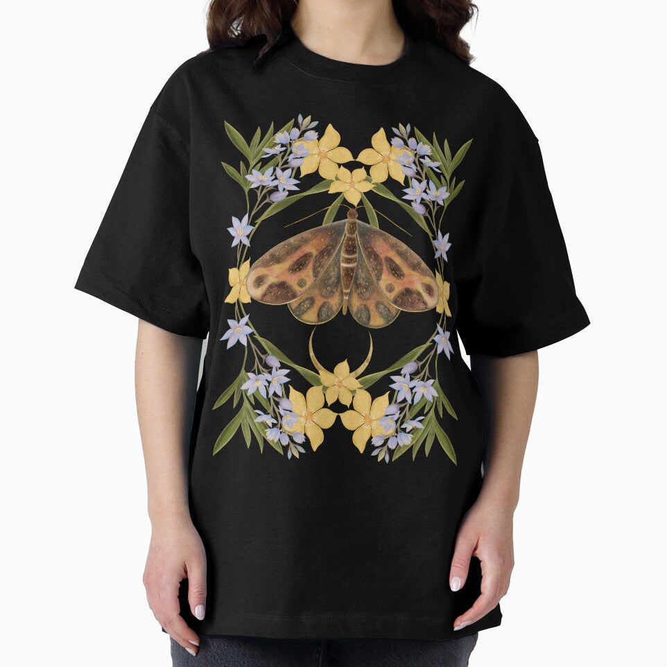 A moody and sophisticated botanical piece featuring a rich, dark-winged moth framed by elegant lavender and yellow blossoms. by Grin Katalina Floral Patterns & Cozy Art